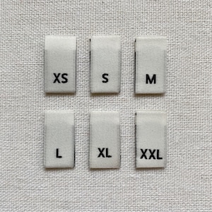 Woven Size Labels - Ivory with Black Letter Sizes XS-XXL | 1 3/4" x 1/2" | Folded Size Labels | High-Quality Fabric Labels | Clothing Tags