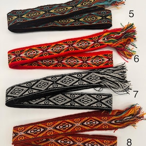 May include: Four woven fabric bands with fringe ends in various colors, including black, red, gray, and orange. The bands have a geometric diamond pattern. The numbers 5, 6, 7, and 8 are written to the right of each band.