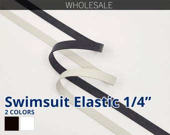 May include: Two spools of 1/4 inch wide elastic for swimwear. One spool is black and the other is white.  Swimsuit Elastic 1/4" 2 COLORS