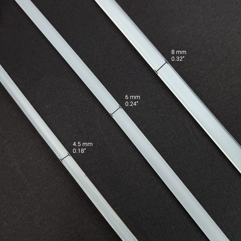 May include: Three white glass rods of different sizes. The rods are 4.5 mm (0.18 inches), 6 mm (0.24 inches), and 8 mm (0.32 inches) in diameter.