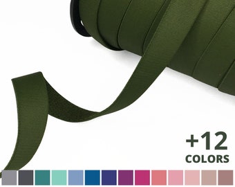 May include: A roll of dark green cotton webbing tape. The tape is 1 inch wide and has a soft, textured finish.  +12 COLORS