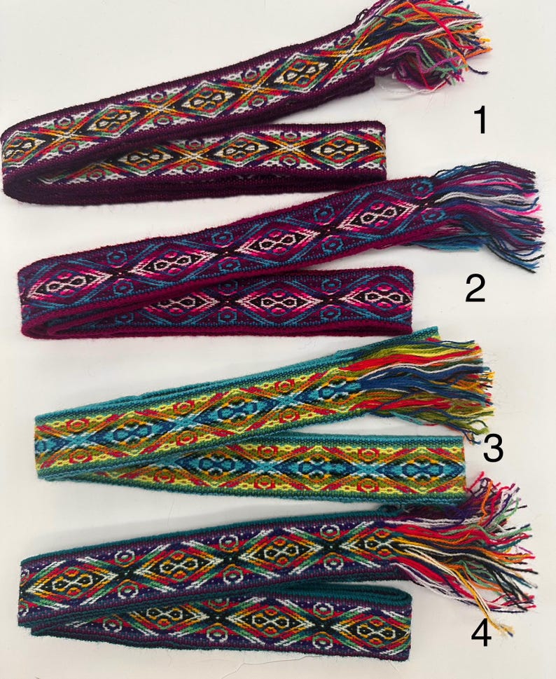 May include: Four woven fabric bands with colorful geometric patterns and fringe ends. The bands are numbered 1 through 4.