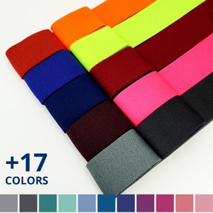 May include: A selection of 17 colors of elastic fabric, including red, orange, yellow, green, blue, purple, pink, and gray. The fabric is shown in a fan shape, with the colors arranged in a rainbow pattern. +17 COLORS