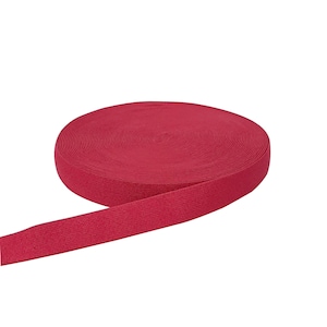 May include: A roll of red elastic band, ideal for sewing and crafting projects.
