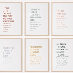 May include: Six printable wall art prints with inspirational bible verses in various colors. The verses are printed in a modern font style on a white background.