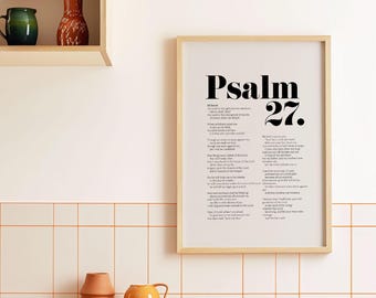 May include: A framed print of Psalm 27 in black text on a white background. The frame is light wood and the print is hanging on a white tiled wall.