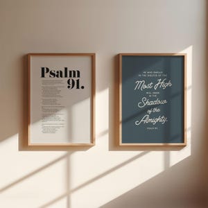 May include: Two framed prints with a white background and black text. The left print features the text "Psalm 91." The right print features the text "He who dwells in the shelter of the Most High will abide in the Shadow of the Almighty. Psalm 91."