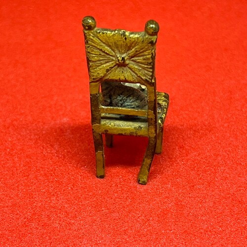 Miniature Vienna bronze Cat on chair playing with shops terrier dog