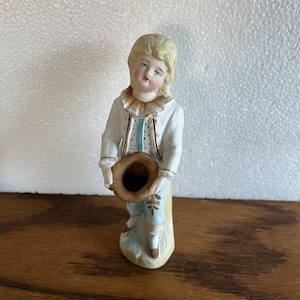 Antique German porcelain bisque little boy with begging hat figurine