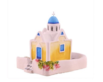 Santorini island, Greece, St Andreas church with blue dome and yard