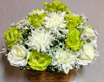 Irish floral. St. Patrick’s Day decor. Green, white roses, white wild dahlia, and babys breath in a woven handle basket. 15x14” faux flowers