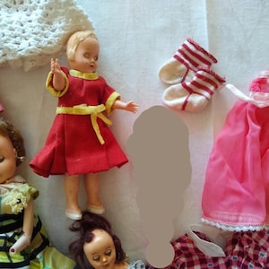 6 Vintage Celluloid Dolls and 1 vintage Baby Rattle