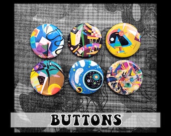 May include: Six colourful round buttons with abstract art designs. The buttons feature a variety of colours, including yellow, blue, red, black, and white. The buttons are arranged in a circle on a grey background. The word "BUTTONS" is printed in black letters on a white background below the buttons.