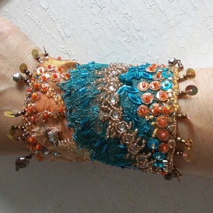 Manually stitched hand beaded collage wrist cuff bohemian fabric wrist wrap bracelet oriental jewelry statement vintage textile romantic