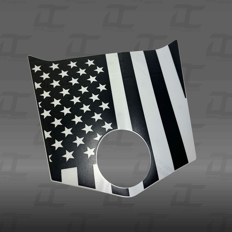 May include: Black and white American flag decal with a thin white stripe and a circle cut out in the center.