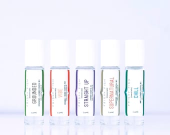 Ensemble de cinq mélanges d'huiles essentielles dans un rouleau pour aromathérapie aller