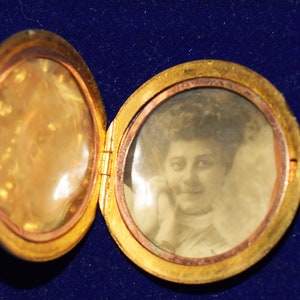 Late 1800s solid gold locket with photograph and diamonds.