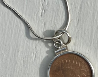 Old Indian head penny encased in sterling silver with bail for chain