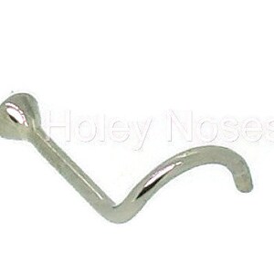 May include: A silver nose screw with a curved post and a small, rounded head. The jewelry is designed for nose piercings. The image is set against a white background.
