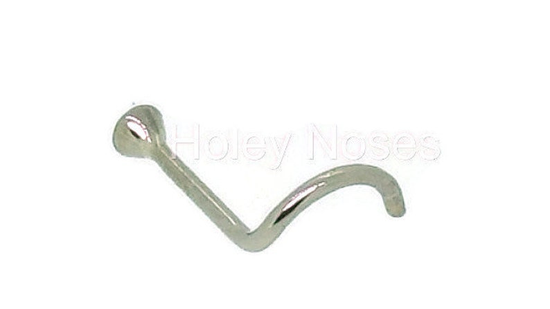 May include: A silver nose screw with a curved post and a small, rounded head. The jewelry is designed for nose piercings. The image is set against a white background.