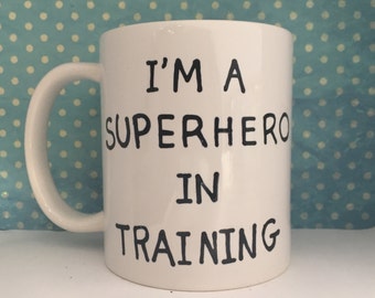 I'm a Superhero in training white coffee mug