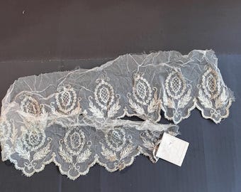 1910- 20’s  Wide Cream Silk Tulle With Silver Metallic Embroidered Lace Trim- 1 Yard  X  6 Inches with Tag. Silver Metallic Lace Trim