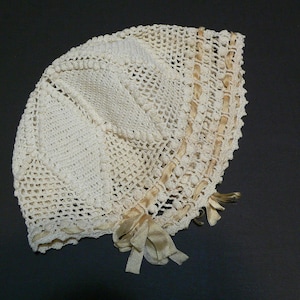 1920s Crochet Baby Doll Bonnet with Silk Ribbons.