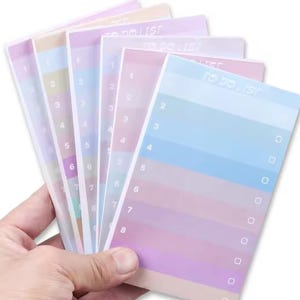 May include: A set of pastel colored to-do list sticky notes with numbered lines and check boxes. The notes are translucent and have a rainbow gradient.