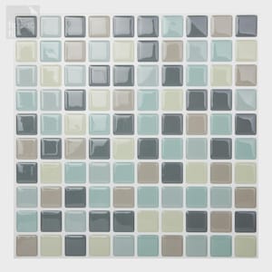 May include: A square wall tile sheet featuring a grid of small, glossy, square tiles in a repeating pattern of muted blue, soft gray, beige, and off-white colors. Each individual tile has rounded edges and a smooth, reflective surface finish.