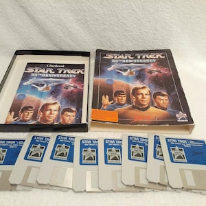 May include: A Star Trek 25th Anniversary game box set with a blue and white game board, a rule book, and six floppy disks. The box set features a photo of the Star Trek cast on the front.