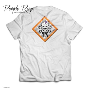 May include: White t-shirt with a diamond-shaped graphic on the back. The graphic features a skull and crossbones with a purple insect on the skull's head. The text "TX" is inside the diamond. The text "Purple Reign Apparel" is printed on the front of the shirt.