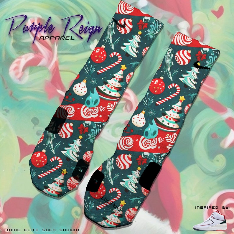 May include: A pair of Christmas themed basketball socks with a green and red candy cane, Christmas tree, and ornament pattern. The socks are Nike Elite socks. The text "Purple Reign Apparel" is in the top left corner of the image. The text "Inspired by" is in the bottom right corner of the image.