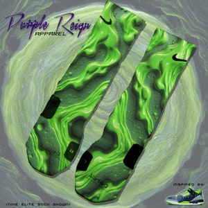 May include: A pair of green and black Nike Elite socks with a slime-like pattern. The socks have the text "DRI-FIT" on the bottom. The socks are inspired by a pair of green and black Nike sneakers.