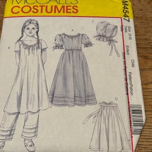 May include: A sewing pattern for a child's costume. The pattern includes instructions for a dress, skirt, and bonnet. The pattern is for sizes 3-6. The pattern is from McCall's Costumes.