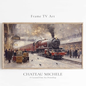 May include: A vintage painting of a red and black steam train pulling into a station. The train is surrounded by people in period clothing. The painting is framed in a light wood frame.