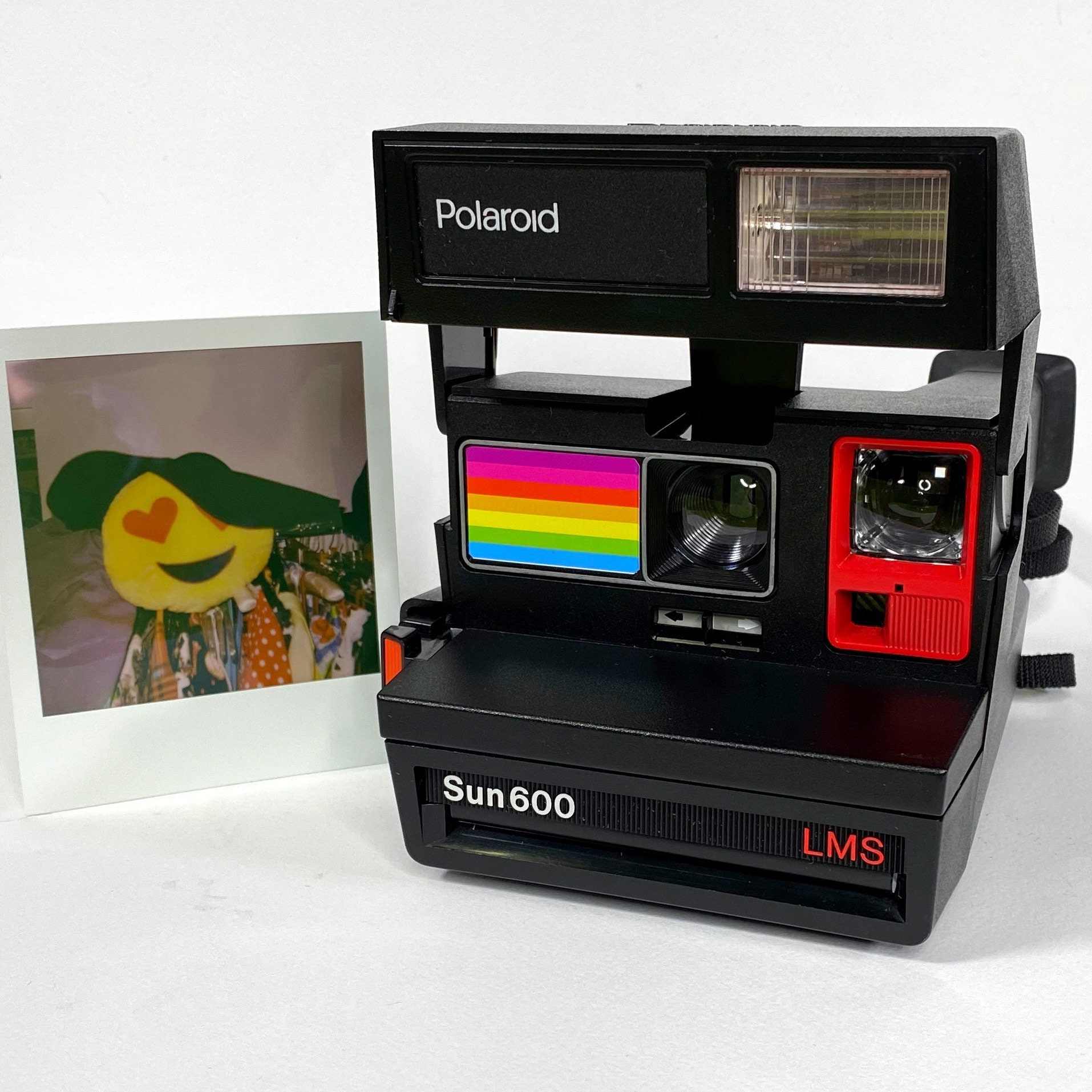 Polaroid Sun 600 with Upcycled red and rainbow face Refreshed