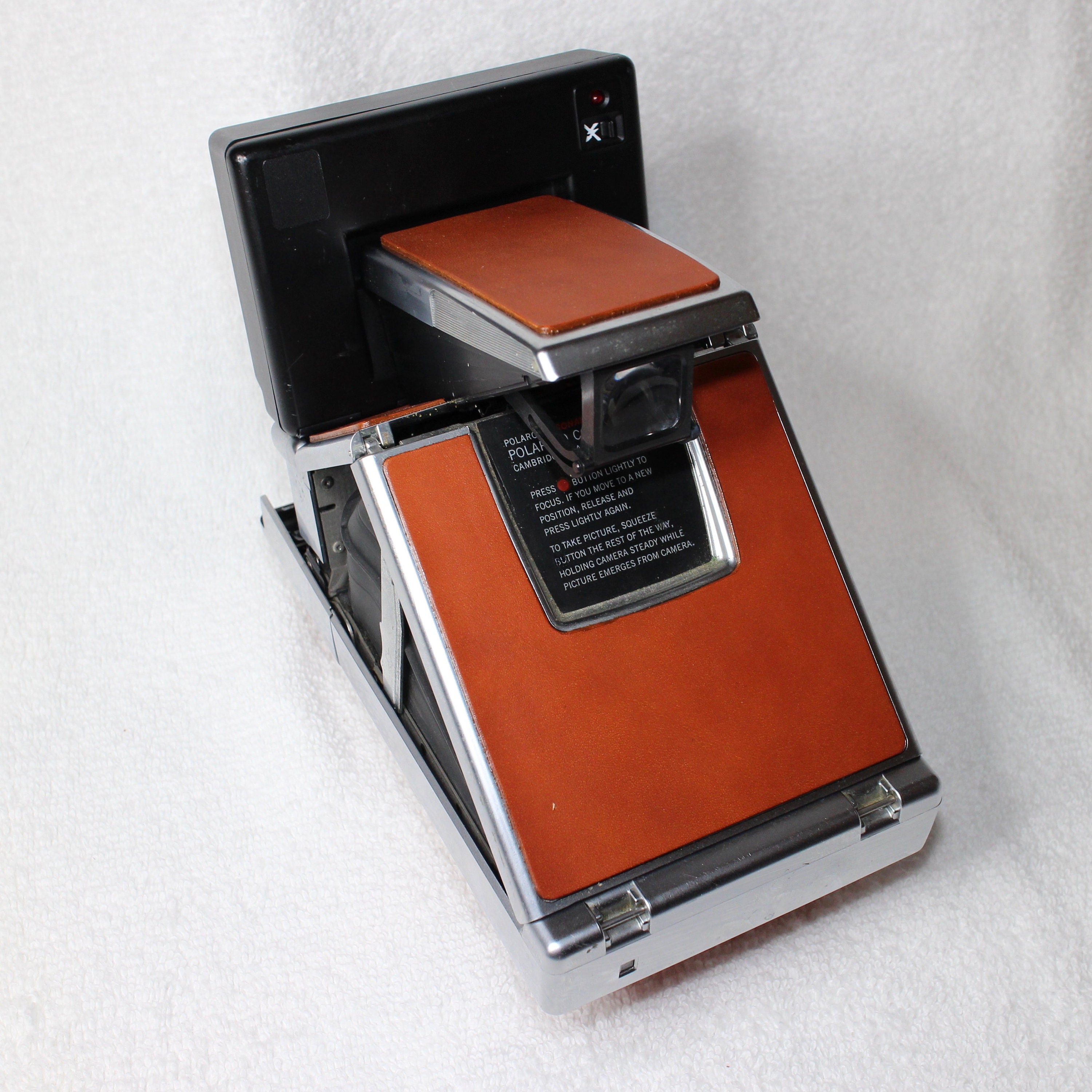 Rebuilt Polaroid SLR 680 Camera with unique silver body and Rebuilt Polaroid SLR 680 Camera with unique silver body and