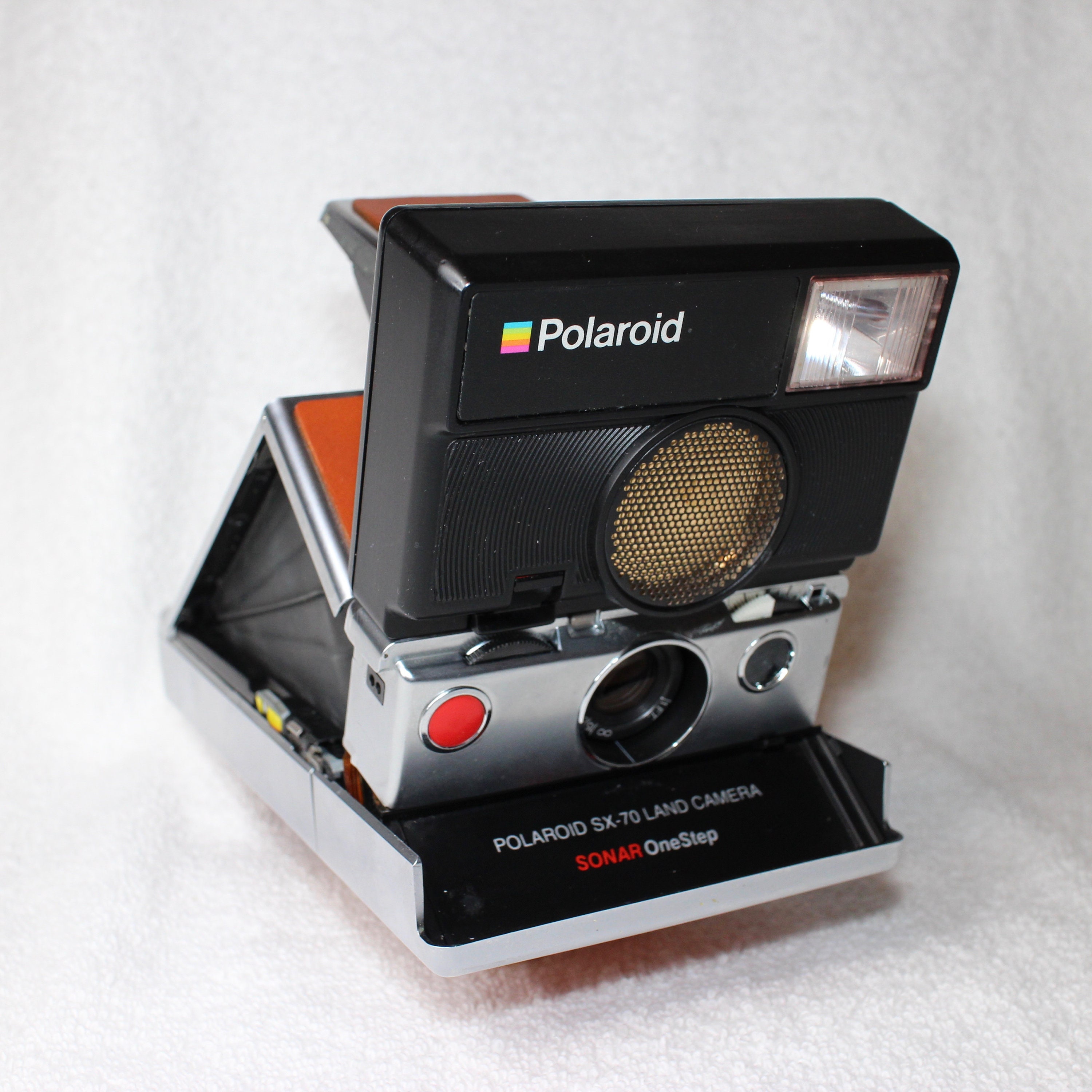 Rebuilt Polaroid SLR 680 Camera with unique silver body and Rebuilt Polaroid SLR 680 Camera with unique silver body and