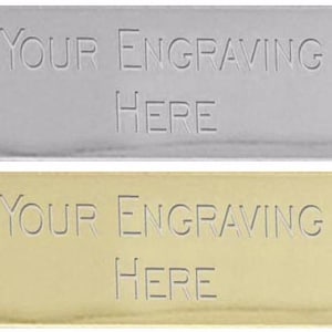 May include: Two rectangular metal plates, one silver and one gold, with the text "YOUR ENGRAVING HERE" engraved on each.