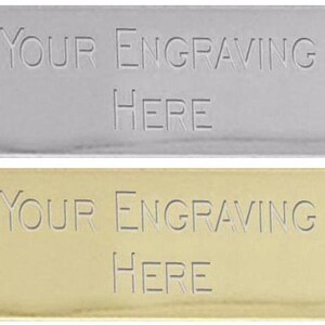 May include: Two rectangular metal plates, one silver and one gold, with the text "YOUR ENGRAVING HERE" engraved on each.