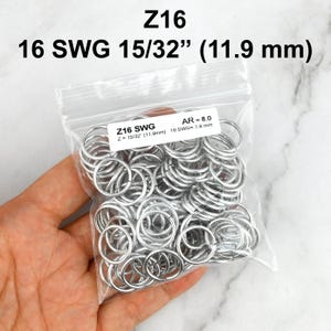 May include: A clear plastic bag filled with silver-coloured metal jump rings. The label on the bag reads Z16 SWG, Z = 15/32" (11.9mm), AR = 8.0, 16 SWG = 1.6 mm. The text Z16, 16 SWG 15/32" (11.9 mm) is also printed above the bag.