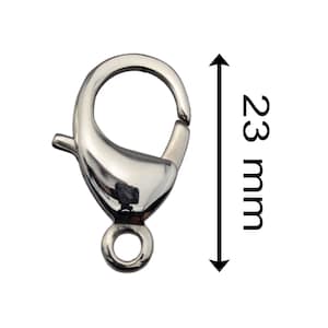 May include: Silver-toned metal lobster clasp with a ring for attaching jewelry or other items. The clasp measures 23 mm in length.