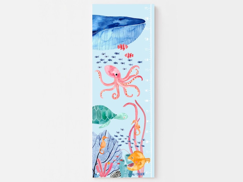 May include: A blue and white growth chart featuring a whale, octopus, sea turtle, seahorse, and other sea creatures. The chart is printed on a light blue background and includes a measurement scale in inches.