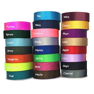 May include: A collection of 24 rolls of webbing in various colors, including fuchsia, navy, sky, canary, plum, latte, apple, lilac, onyx, charcoal, mocha, teal, spruce, carnation, cadet, smoke, army, marine, tangerine, spring, chartruese, rose.