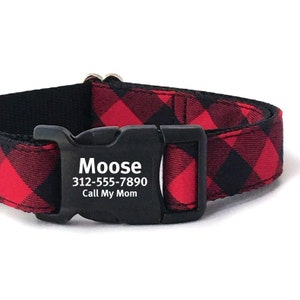 May include: Red and black plaid dog collar with a black buckle. The buckle has the name "Moose" and the phone number "312-555-7890" and the text "Call My Mom" printed on it.