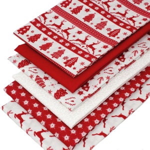May include: A stack of six red and white fabric squares with a Christmas theme. The fabric features a repeating pattern of snowflakes, reindeer, and Christmas trees.