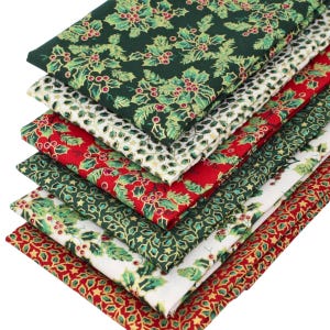 May include: A stack of folded fabric pieces featuring various holiday-themed patterns. The designs include green, red, and white backgrounds decorated with holly leaves, red berries, and gold accents arranged in repeating floral motifs.