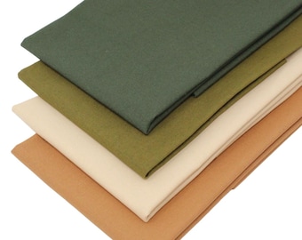 May include: Four fabric swatches in different shades of green, beige, and brown. The swatches are folded and stacked on top of each other.