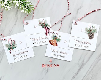 May include: Four different Christmas gift tag designs featuring watercolor illustrations of a candy cane, a stocking, a bell, and a pine cone. Each tag has a space to write "to" and "Merry Christmas" followed by a name.