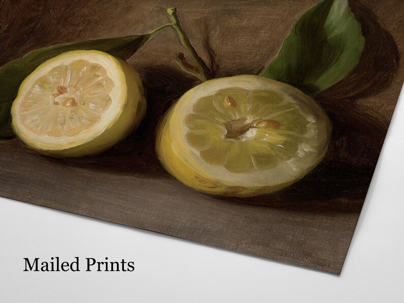 May include: A still life print featuring two halved lemons with green leaves. The lemons are a vibrant yellow, with visible seeds and a textured rind. The background is a dark brown, creating a contrast with the bright fruit. The text "Mailed Prints" is at the bottom.